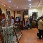 Western tourists enjoy looking at hundreds of ancient Vietnamese lamps in Saigon 0